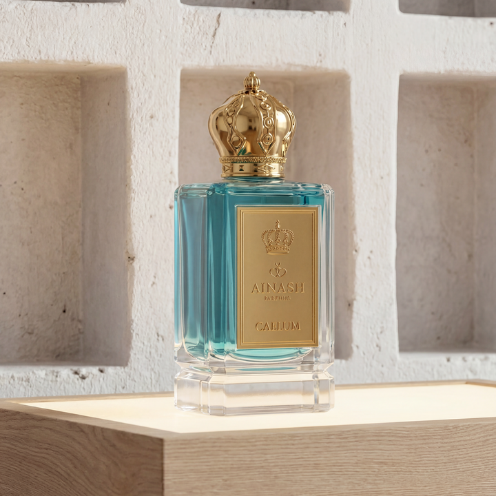 fresh citrus perfume bottle Caelum Ainash Parfums tropical mango pineapple fragrance luxury scent
