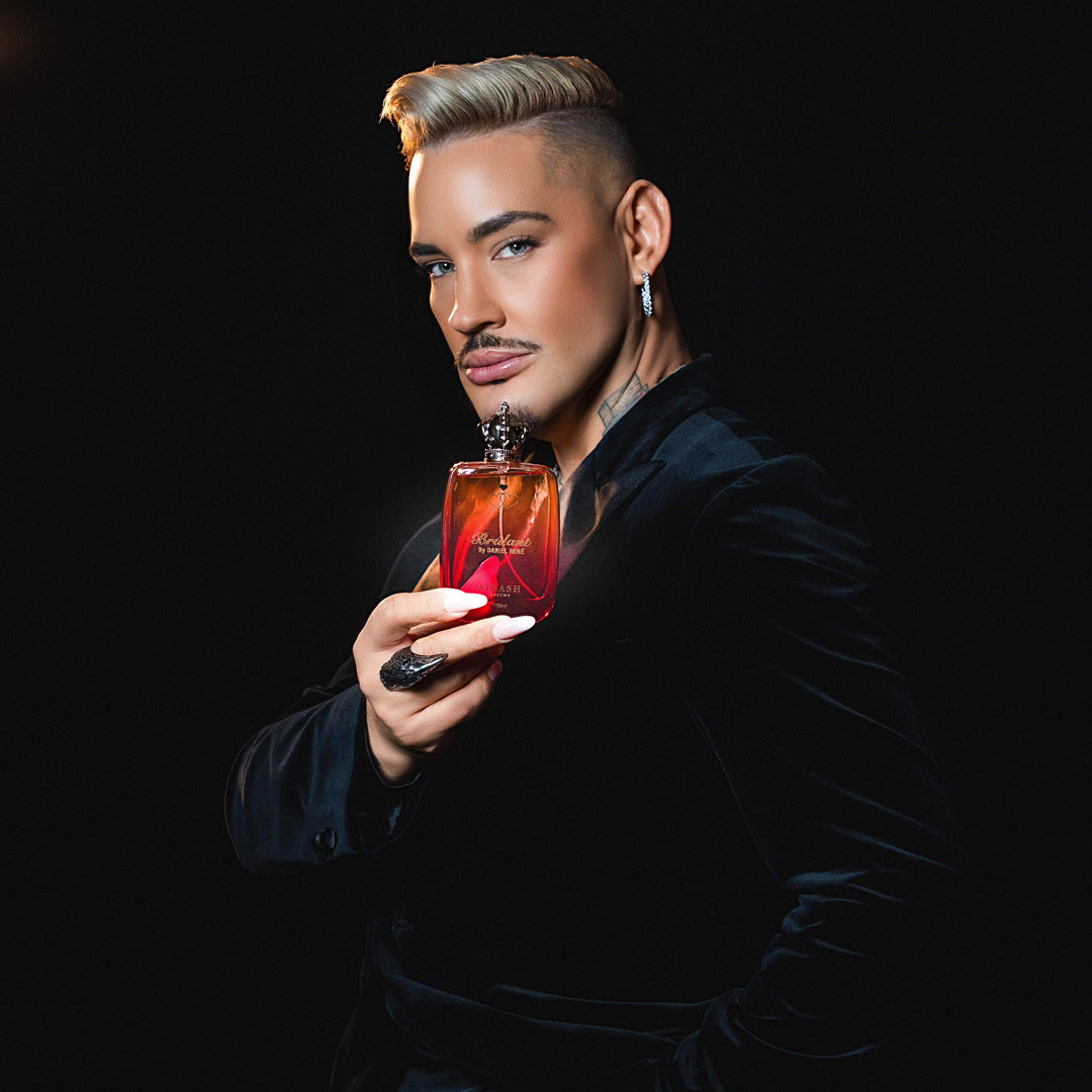 Daniel René holding Brulant – Ainash Parfums collaboration | Unisex spicy gourmand extrait de parfum with red apple, coffee and dark cocoa | As worn by Daniel René