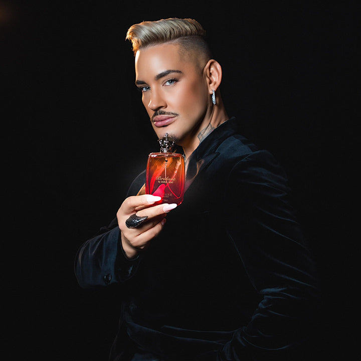 Daniel René holding Brulant – Ainash Parfums collaboration | Unisex spicy gourmand extrait de parfum with red apple, coffee and dark cocoa | As worn by Daniel René